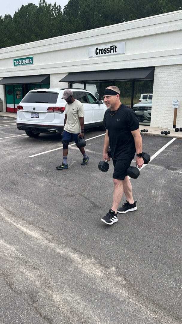 Man Using Rogue Dumbbells.