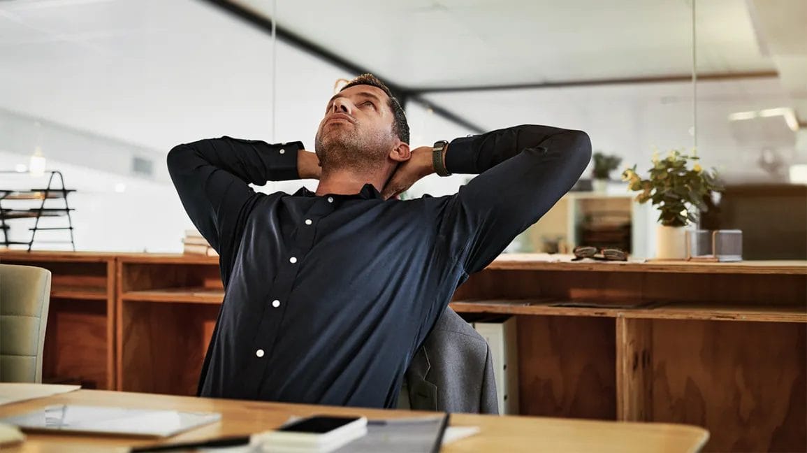 Burn Calories At Work - Person Stretching In Office
