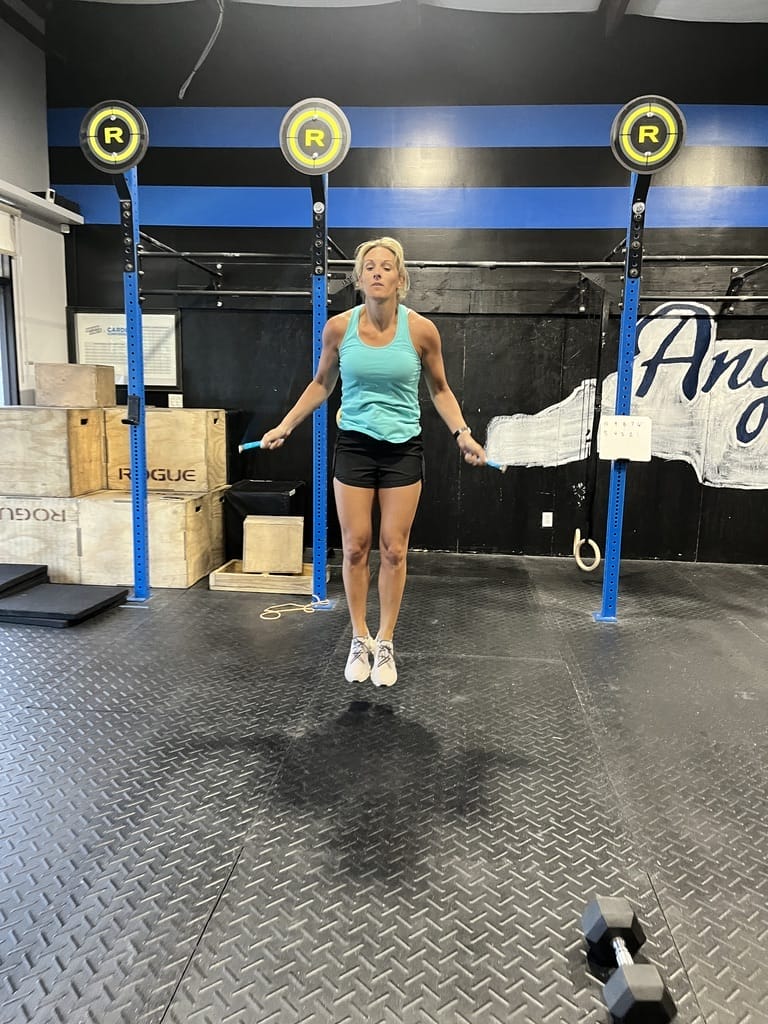 Woman Jumping During Crossfit Workout Wod